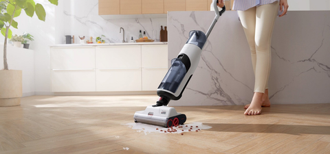 Dyad │Roborock's wet and dry vacuum, is cleaning the milk and crisps from the wooden floor